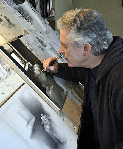 Artist Michael Dumas at work in his studion on his painting "Looking Out"