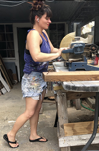 Artist Crystal Obeidzinski preparing her canvas