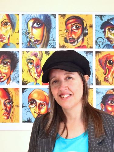 Artist Tara Roskell with her portraits