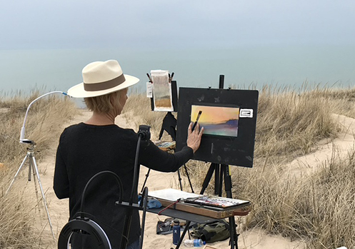 Artist Julie Skoda plein air painting at the Indiana Dunes