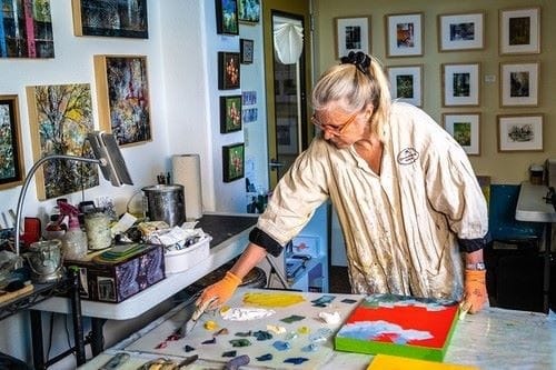 Artist Stephanie Holman Thwaites at work in her studio