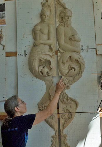 Artist Beckie Kravetz sculpting an architectural commission