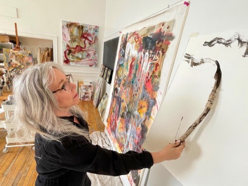 Artist Marli Thibodeau at work in her studio