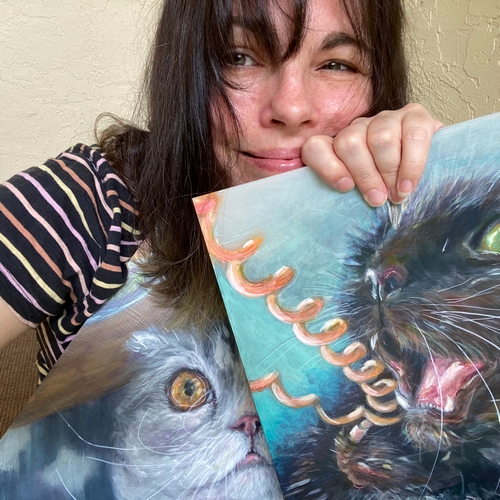 Artist Erika Chapman with her paintings