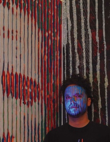 Artist Mauricio Sanchez Rengifo with his work