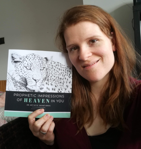 Artist Rebecca Bosch with her book "Prophetic Impressions of Heaven in You"