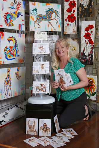 Artist with greeting card display