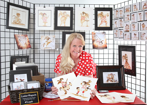 Artist Linda Finstad with her work