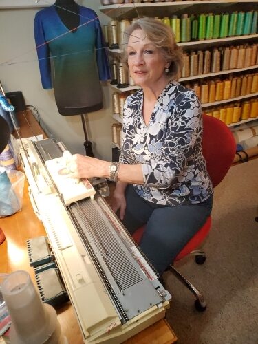 artist Jacquelyn Roesch-Sanchez working with her knitting machine