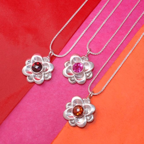 Handcrafted blossom pendants in silver and gemstones