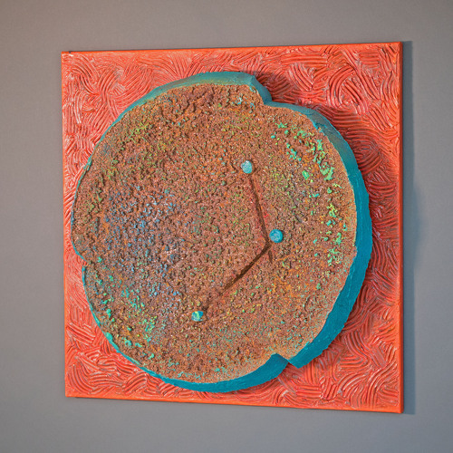 Colorful sculpture with a rusted patina