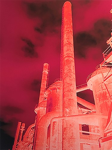 altered photograph of blast furnaces