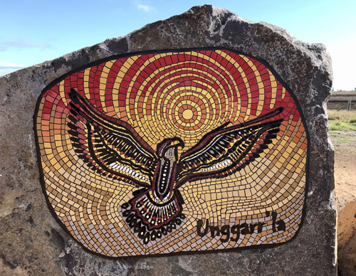 Eagle mosaic on a boulder by Paul Perry