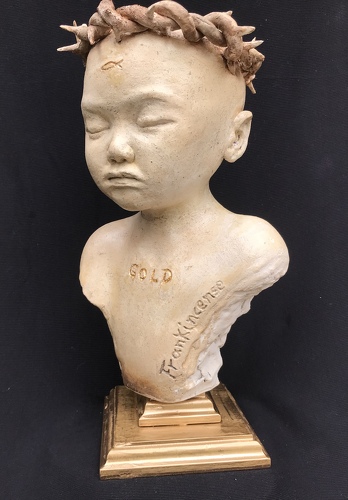 Handbuilt ceramic sculpture of a young child