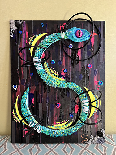 sculptural serpent in mixed media art
