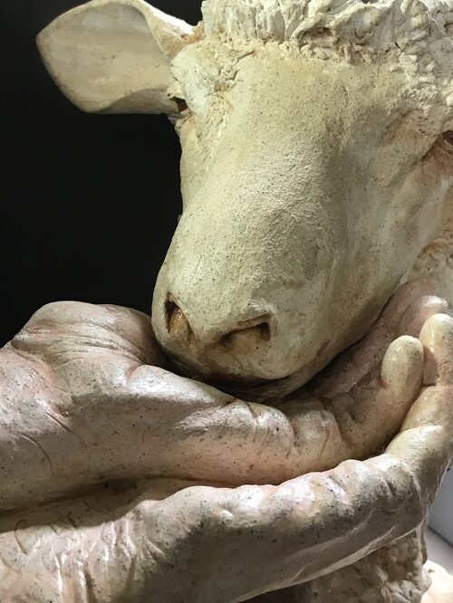 ceramic sculpture of a sheep