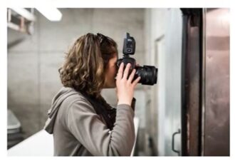 Photographer using a camera