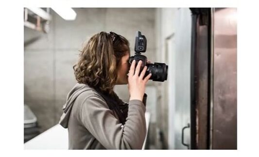 Photographer using a camera