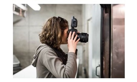 Photographer using a camera