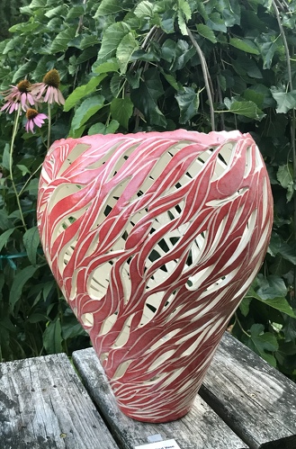 hand built and carved ceramic vessel