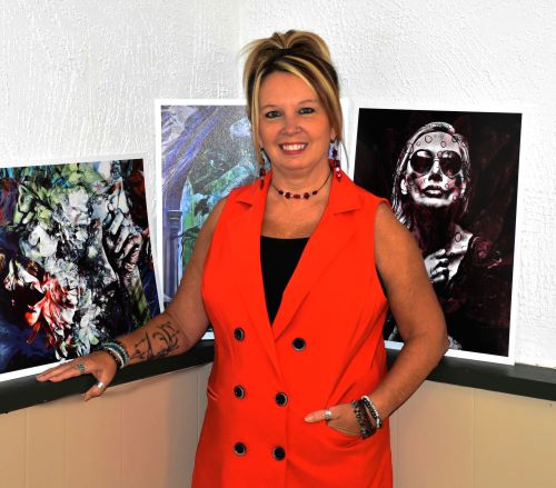 Artist Angela Sanders with artwork