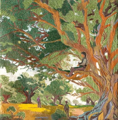 embroidered landscape of a young boy in a tree