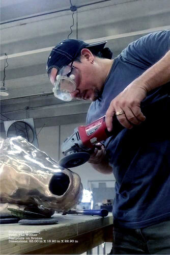 bronze sculptor at work in the studio