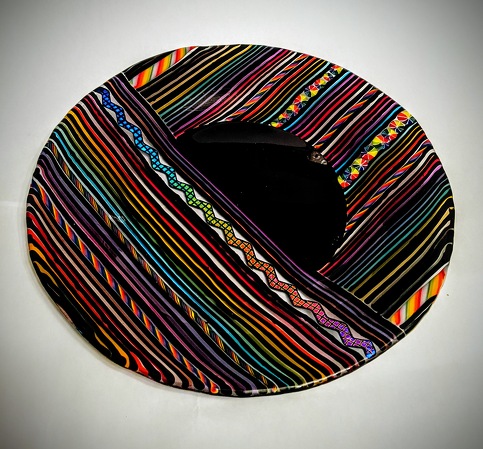 kiln-formed glass rainbow plate by Katherine Berg