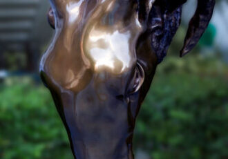 Bronze sculpture of a ram's head by Fermin Fleites
