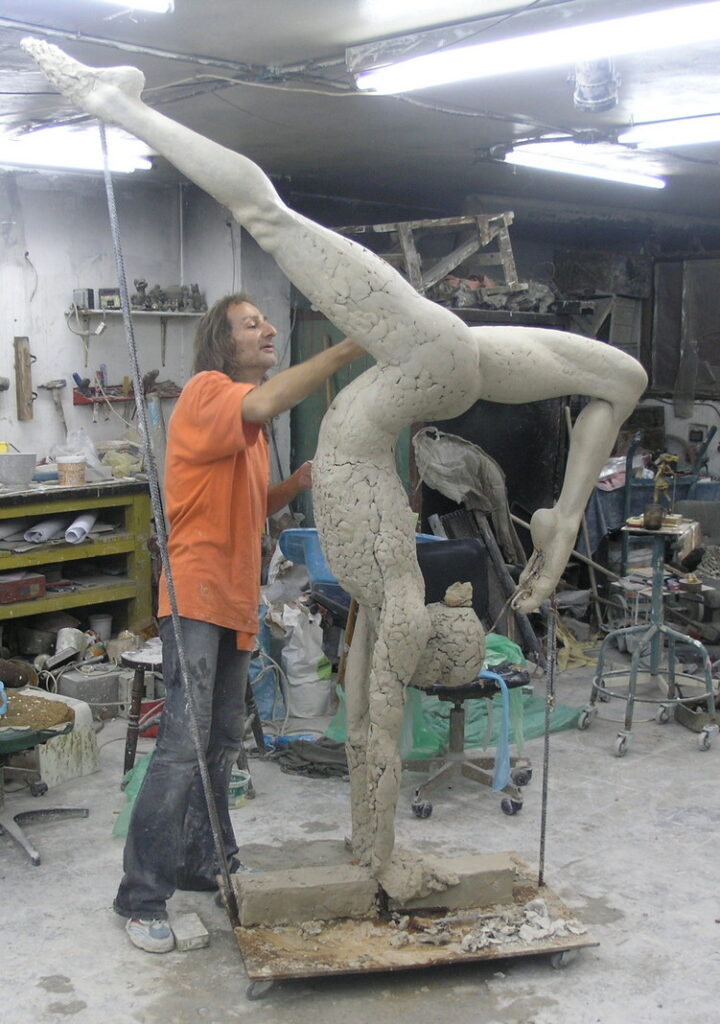 Sculptor at work in studio