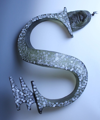 mixed media sculpture of the letter S 