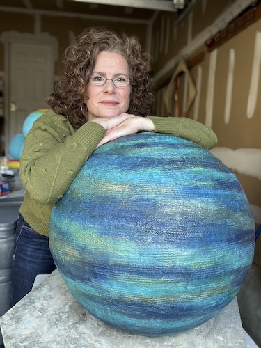 Sculptor with her cement sculpture