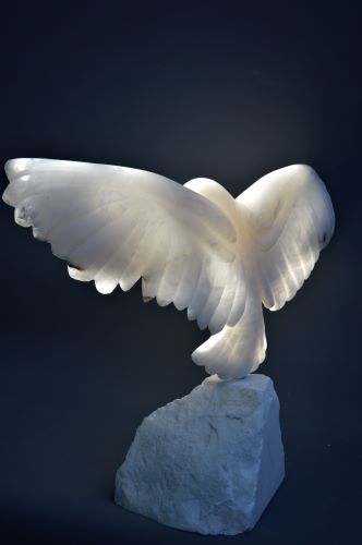 alabaster sculpture of a bird in flight