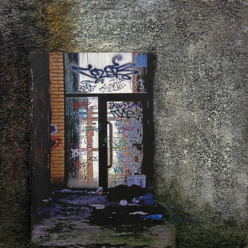 mixed media photograph of graffiti on pumice background