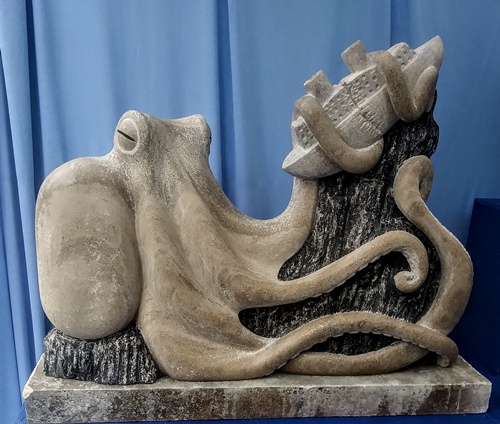 limestone sculpture of a giant octopus and ship