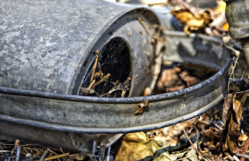 photograph of an old watering can