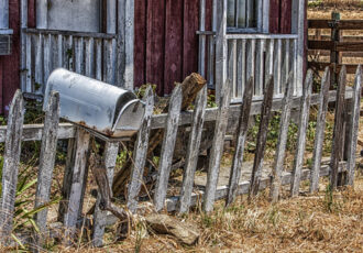 photo of an old fence and mailbox