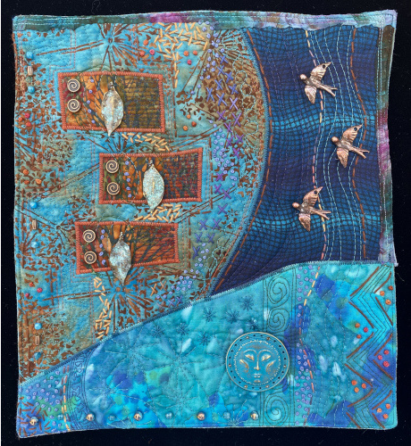 colorful art quilt with a sky and bird theme