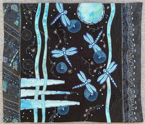 moon and firefly themed art quilt