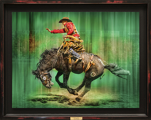 photo of a rider on a bucking bronco