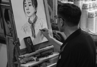 a man painting a picture