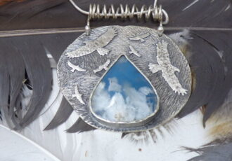 handmade silver pendant with birds and stone with cloud look