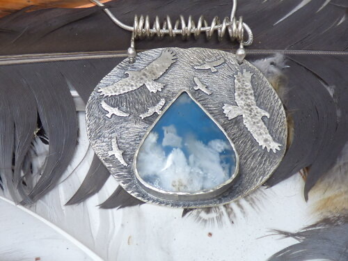 handmade silver pendant with birds and stone with cloud look
