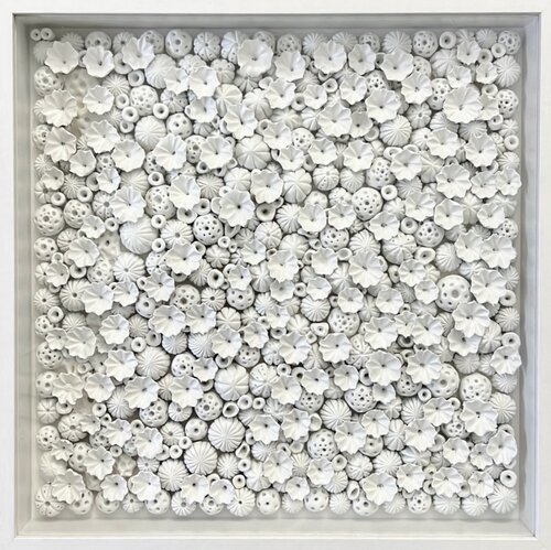 framed collage artwork of clay coral objects