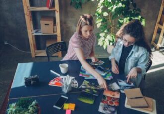 two women reviewing a portfolio