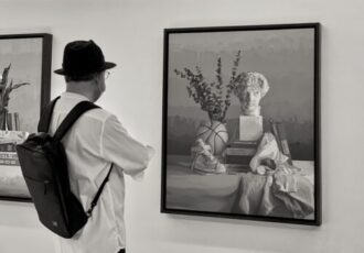 man viewing art for sale