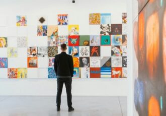 man viewing art in a gallery