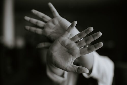 hands blocking out reality
