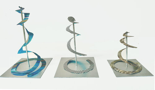 set of three spiral sculptures