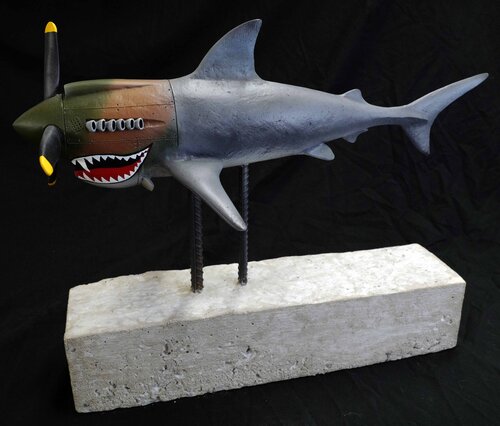 whimsical sculpture of a shark/vehicle